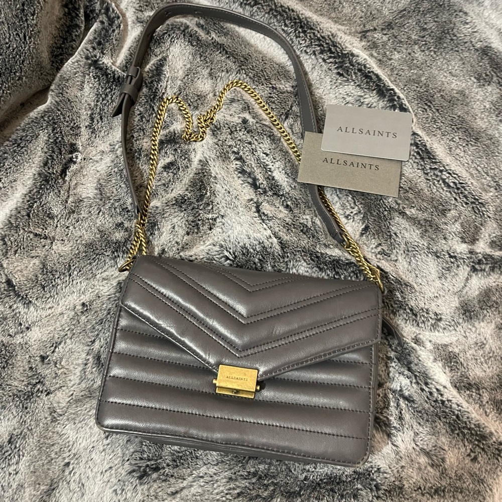 AllSaints Justine Chain Wallet
Graphite Grey, gold chain and gold